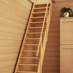 Wooden stationary staircase to the attic