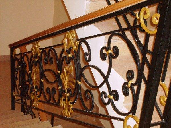 Wrought iron railing with gilded elements
