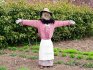 Garden scarecrow - a doll made of wooden planks and old clothes